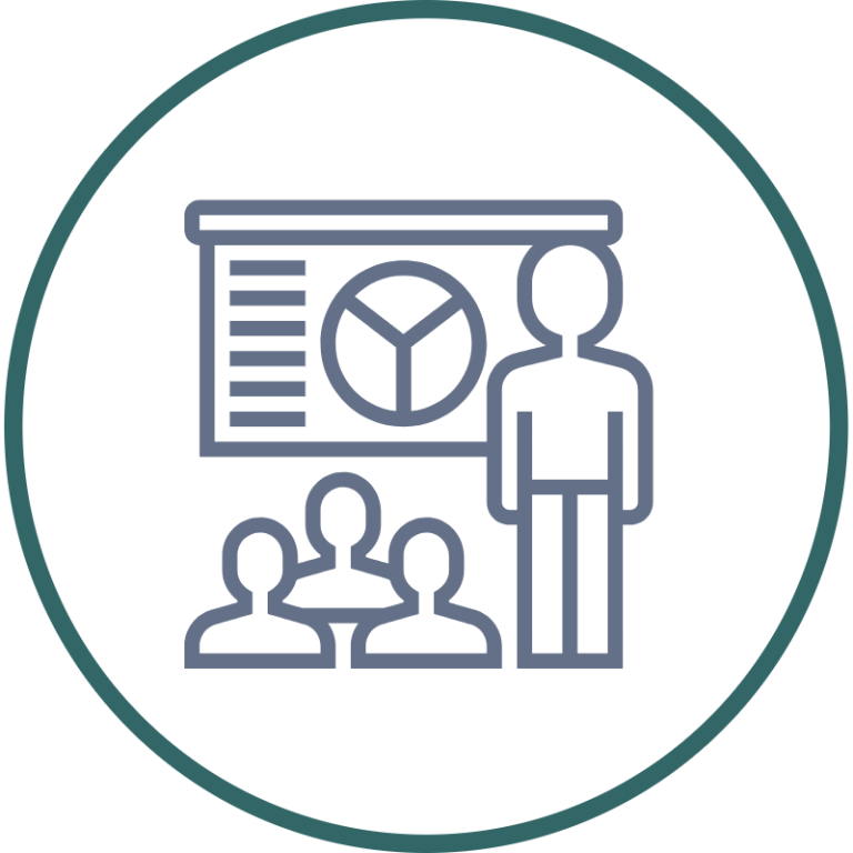 Workshops A smiling speaker at a podium with microphones.